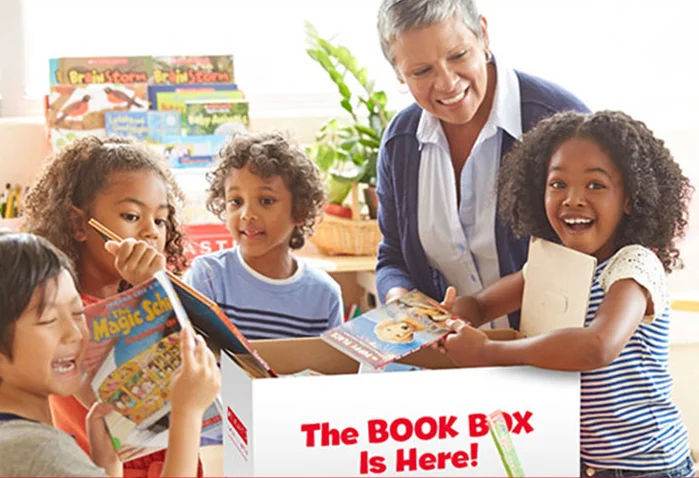 Picture of Children Openng the Scholastic Big Box